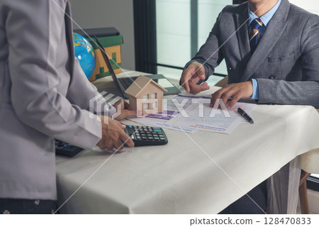 Businessman real estate house agent teamwork discuss team businessperson. Team partner man women selling house real estate agent at office desk. Team working home insurance mortgage sale apartment Businessman real estate house agent teamwork discuss team businessperson. Team partner man women selling house real estate agent at office desk. Team working home insurance mortgage sale apartment 128470833