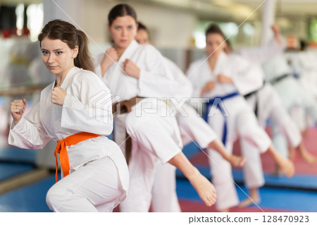 Women in a white kimono in training on a map 128470923