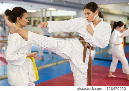 Women in kimonos do karate 128470950