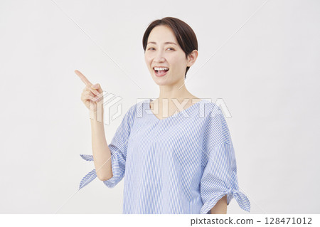 Woman, middle-aged, pointing to the left, white background Woman, middle-aged, pointing to the left, white background 128471012