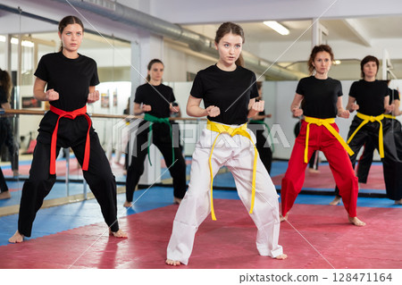 Women in sportswear in self-defense training 128471164