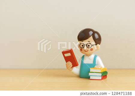 Male bookstore clerk holding a book Male bookstore clerk holding a book 128471188