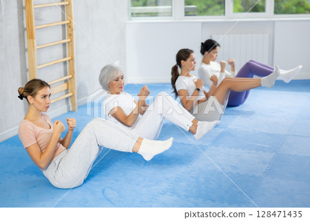 Athlete before martial match performs exercises to strengthen press and improve accuracy of hands 128471435