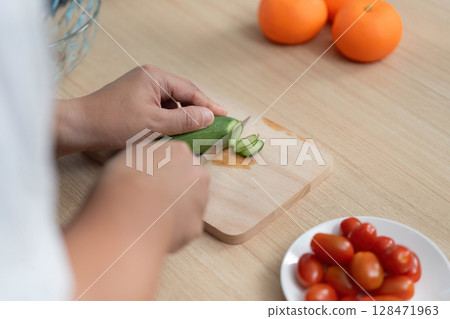 Healthy Cooking. Preparing fresh vegetables in a modern kitchen. Healthy Cooking. Preparing fresh vegetables in a modern kitchen. 128471963