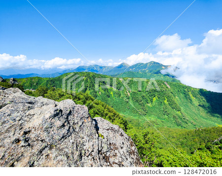 Climbing Mt. Myoko in summer (view of Mt. Yakeyama and Mt. Hiuchiyama from the top of the northern peak) Climbing Mt. Myoko in summer (view of Mt. Yakeyama and Mt. Hiuchiyama from the top of the northern peak) 128472016