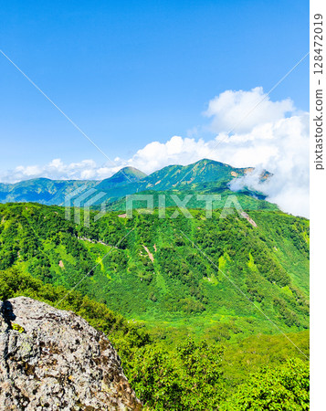 Climbing Mt. Myoko in summer (view of Mt. Yakeyama and Mt. Hiuchiyama from the top of the northern peak) Climbing Mt. Myoko in summer (view of Mt. Yakeyama and Mt. Hiuchiyama from the top of the northern peak) 128472019
