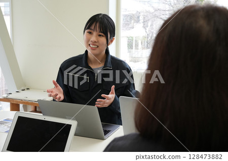 An employee working at a company An employee working at a company 128473882