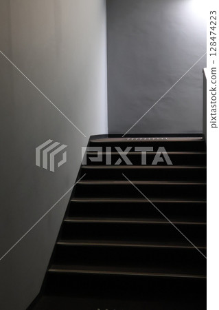 Dimly lit stairs inside the facility 128474223