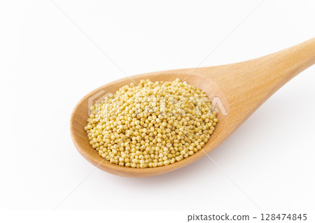 Close-up of yellow mochi millet on a spoon 128474845
