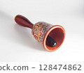 Decorative hand painted wooden hand bell. 128474862