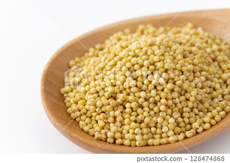Close-up of yellow mochi millet on a spoon 128474868