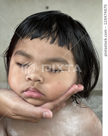 Close up portrait of little Asian girl sleeping 128474870