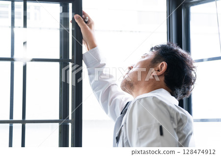 Window inspection contractor lifestyle image Window inspection contractor lifestyle image 128474912