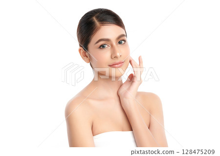 A beautiful young Asian woman with clean, fresh skin against a white background. Skincare, facial treatment, cosmetology, beauty, and spa. An elegant portrait of an Asian woman. A beautiful young Asian woman with clean, fresh skin against a white background. Skincare, facial treatment, cosmetology, beauty, and spa. An elegant portrait of an Asian woman. 128475209