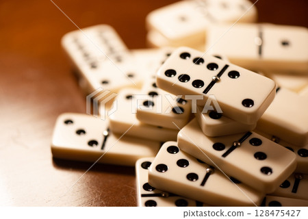 Heap of Domino tiles 128475427