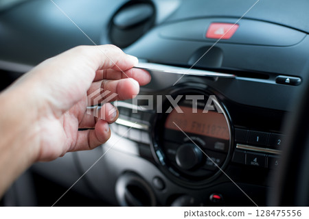 Modern car radio and CD player 128475556