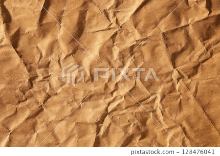 Brown crumpled paper material texture Brown crumpled paper material texture 128476041