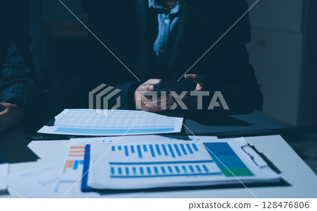 Two business people analyzing the data Two business people analyzing the data 128476806