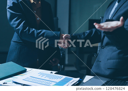 Close-up of handshake of businesswoman and businessman 128476824