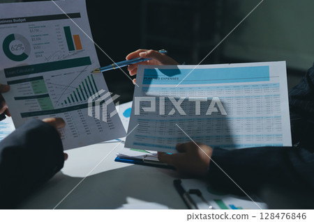 Group of business women working on a financial data expenses document. 128476846