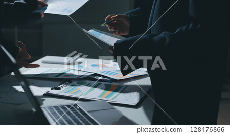 Group of business women working on a financial data expenses document. 128476866