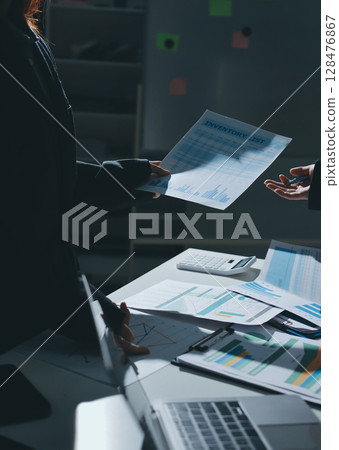 Group of business women working on a financial data expenses document. 128476867