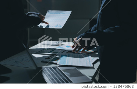 Group of business women working on a financial data expenses document. 128476868