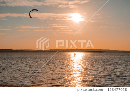 Walking on water holding a Kite. 128477058