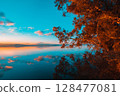Tranquil Sunset Reflection 128477081