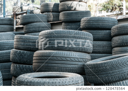 Used Worn Out Car Tires Piled Outdoors 128478564