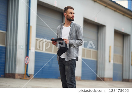 Handsome and young truck driver in casual clothes Handsome and young truck driver in casual clothes 128478693