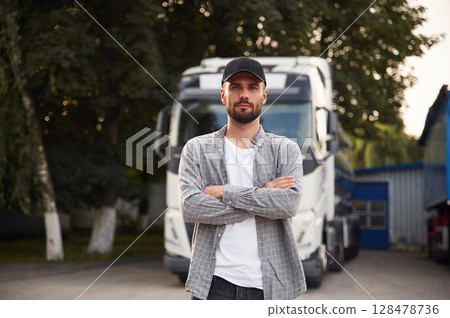 Handsome and young truck driver in casual clothes 128478736