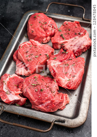 Raw beef boneless shank shin meat with herbs and spices ready for cooking. isolated on white background. top view 128478845