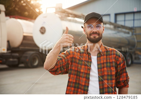 Front view. Young truck driver in casual clothes 128479185