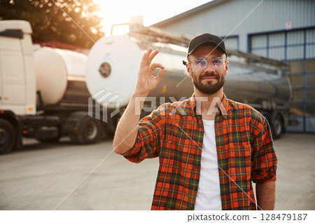 Front view. Young truck driver in casual clothes 128479187