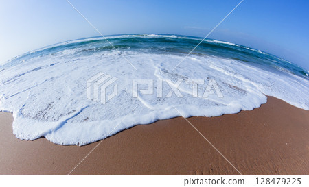 Beach Sand White Water Wash Blue Ocean Horizon 128479225