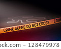Outline of human's body is drawn on a dark wooden floor background 128479978