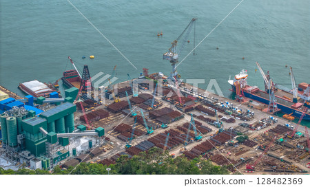July 13 2025 View of a Busy Industrial Seaport with Docked Cargo Ships 128482369
