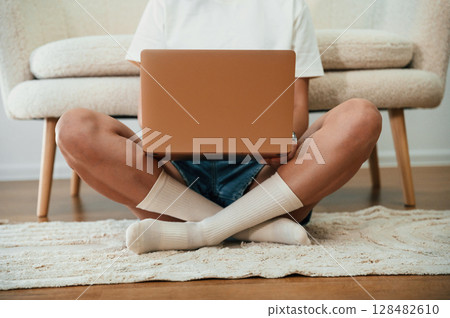 Close up view of woman that is using laptop 128482610