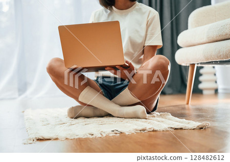 Close up view of woman that is using laptop Close up view of woman that is using laptop 128482612