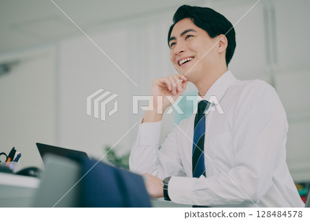 A man working in a suit 128484578