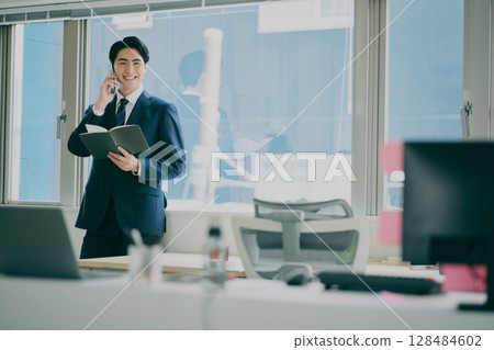 A man working in a suit 128484602