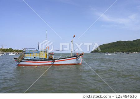 Fishing boat in the bay near Nha Trang, Vietnam, in the South China Sea 128484630