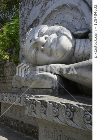 Fragment of statue of lying Buddha at Long Son Pagoda in Nha Trang, Vietnam 128484632