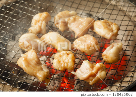 Offal being grilled on a charcoal grill (round intestines) 128485002