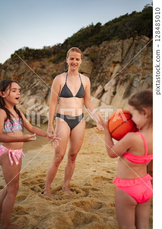 Fun family moments building memories at the beach with kids Fun family moments building memories at the beach with kids 128485010