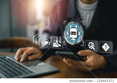 Business professional using technology for customer support, featuring digital icons and modern devices. 128485371