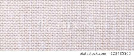 White and cream woven textile macro texture background. Knitted fabric pattern for material design and backdrop White and cream woven textile macro texture background. Knitted fabric pattern for material design and backdrop 128485563