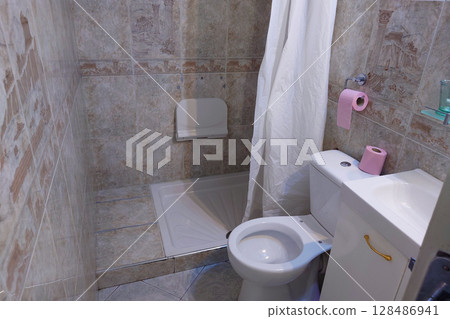 Old public toilet 128486941