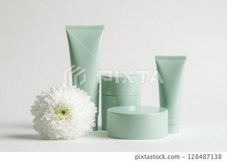 Blank cream tube, jar package plastic set. Pale mint green colors. Skin care luxurious portable on white background, soft shadow. Eco cosmetic containers, flowers. Beauty product modern packaging. Blank cream tube, jar package plastic set. Pale mint green colors. Skin care luxurious portable on white background, soft shadow. Eco cosmetic containers, flowers. Beauty product modern packaging. 128487138